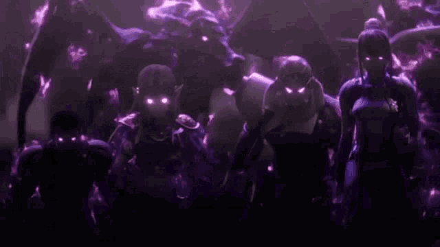 a group of people are standing next to each other in a dark room with purple lights .