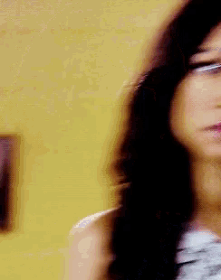 a blurry picture of a woman with long hair