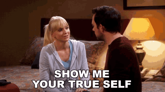 a man and a woman are sitting on a bed with the words show me your true self