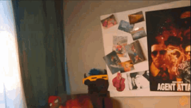 a room with a poster that says agent rtd