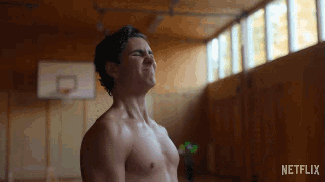a shirtless man in a gym with the netflix logo on the bottom right