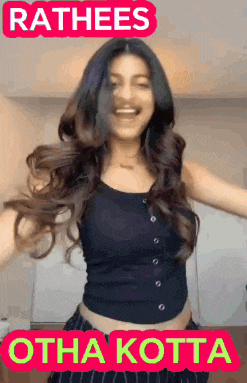a woman in a black tank top is dancing with the words rathees othakotta written above her