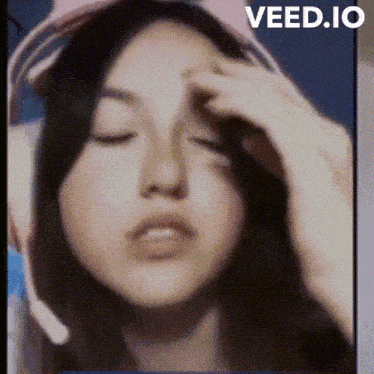 a close up of a woman 's face with the words veed.io written on the bottom