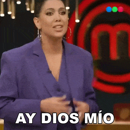a woman in a purple suit is standing in front of a red m and says ay dios mio .