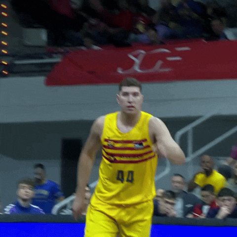 a basketball player wearing a yellow uniform with the number 40 on it