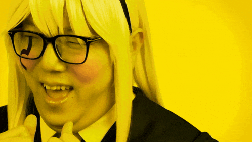 a woman wearing glasses and a headband with a letter j on it