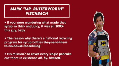 a man in a batman apron is covering his face with his hand while talking about mark " mr. butterworth " fischbach