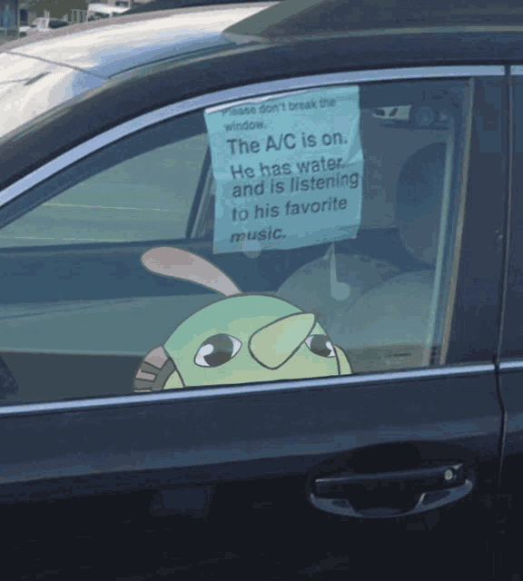 a sign in the window of a car that says the a/c is on