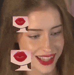 a close up of a woman with red lips