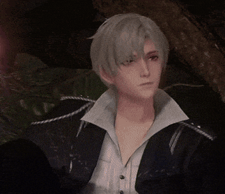 a man with gray hair wearing a black jacket and white shirt