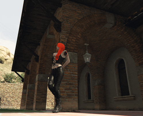 a woman with red hair is standing in front of a large brick building