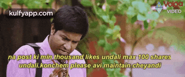 a man in a suit and tie is making a funny face while talking to someone .