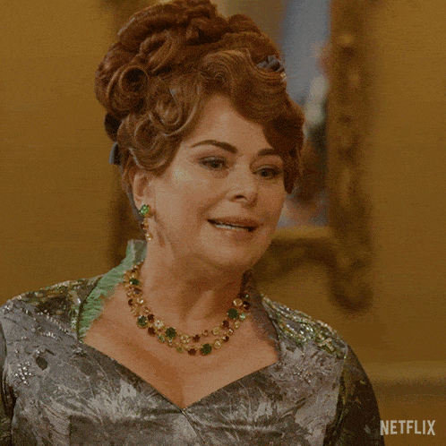 a woman in a green dress with the words keep a low profile