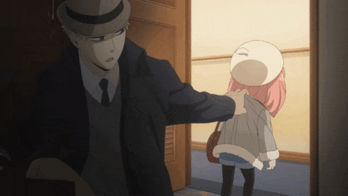 a man and a girl are standing next to each other in a dark room