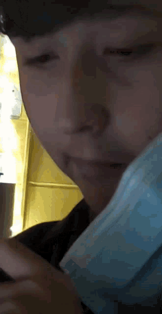 a close up of a person 's face with a mask on
