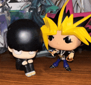a funko pop of yugi and mob psycho 100
