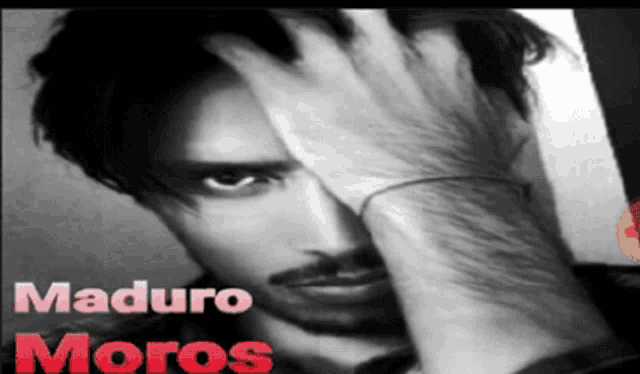 a black and white photo of a man with the name maduro moros written in red