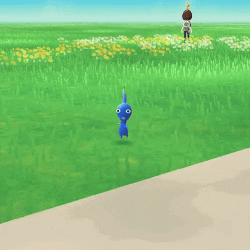 a blue cartoon character is standing on a grassy field