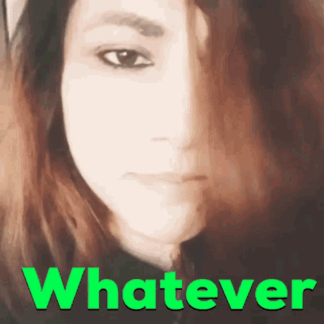 a woman 's face is shown with the word whatever in green
