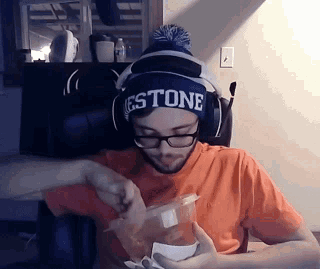 a man wearing a beanie that says estone