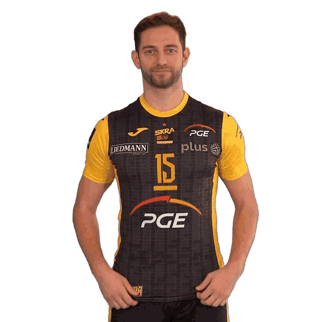 a man wearing a black and yellow pge jersey