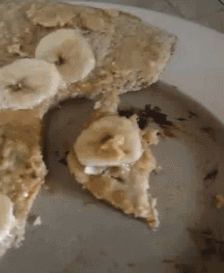 a slice of pizza with banana slices and peanut butter on it