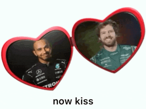 a pair of heart shaped mirrors with two men on them and the words now kiss below them