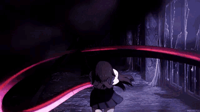 a girl in a school uniform is standing in a dark room with a pink light coming out of her hand .