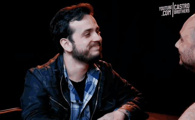 two men are sitting at a table with youtube castro brothers written on the bottom