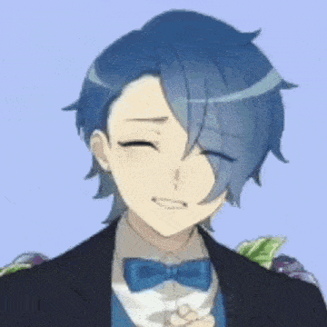 a boy with blue hair is wearing a suit and bow tie and smiling .
