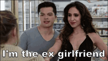 a man and a woman are talking to each other in a store and the woman is saying i 'm the ex girlfriend