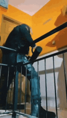a person is walking down a set of stairs with a umbrella .
