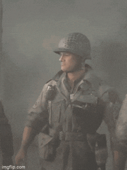 a soldier is wearing a helmet and holding a grenade