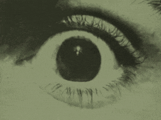 a close up of a human eye with the words we watch above it