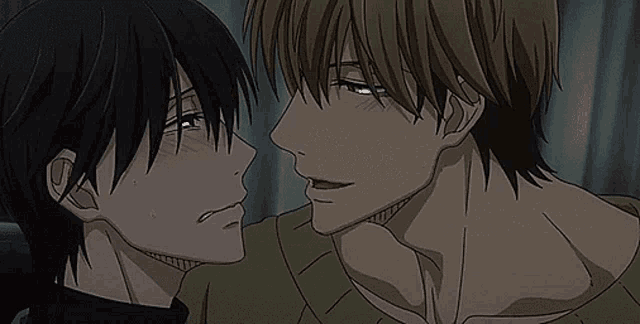 a couple of anime characters kissing each other on the cheek .