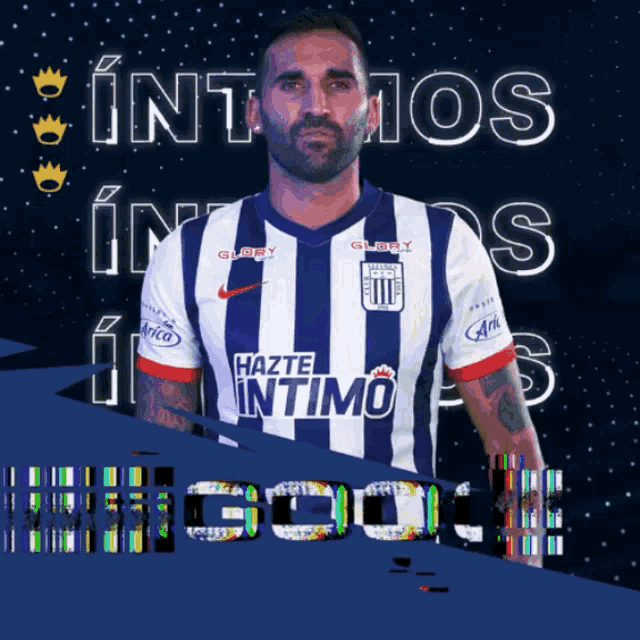 a man in a hazte intimo jersey stands in front of a blue background