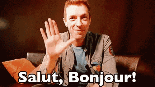 a man is sitting on a couch and waving his hand with the words salut bonjour written below him