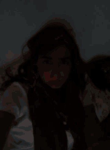 a woman wearing a red scarf and a white shirt