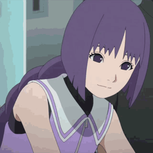 a girl with purple hair is wearing a purple and white shirt