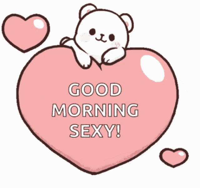a teddy bear is laying on top of a pink heart and says good morning sexy .