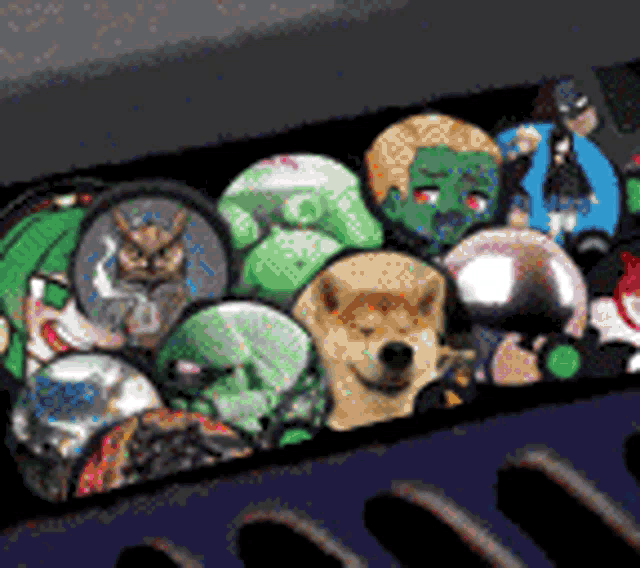 a bunch of stickers on a black surface with a dog in the middle