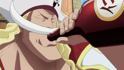 a man in a white hat is drinking from a red bottle with the letter y on it