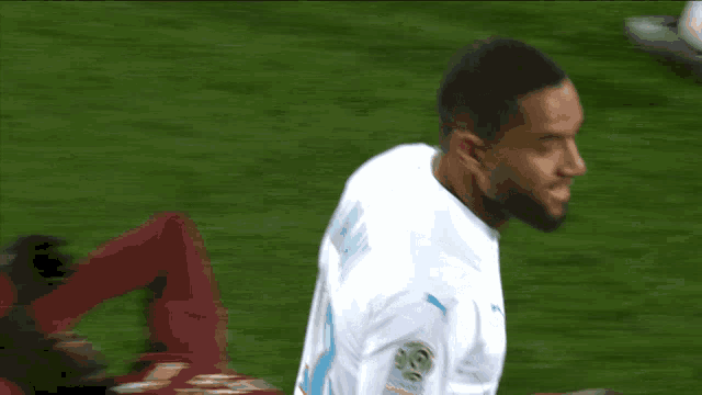 a soccer player wearing a white jersey with the number 10 on it