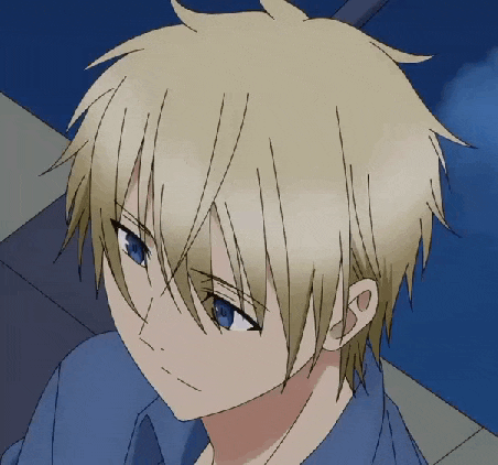 a boy with blonde hair and blue eyes is looking down