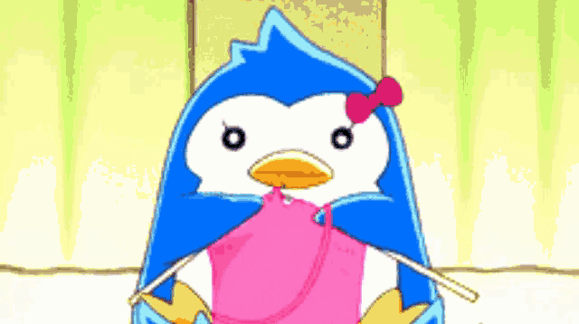 a blue and white penguin with a pink bow on its head is knitting