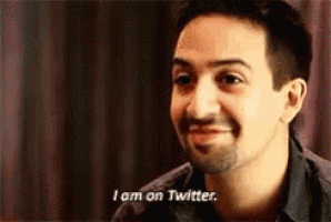 a man is smiling and says `` i am on twitter '' .