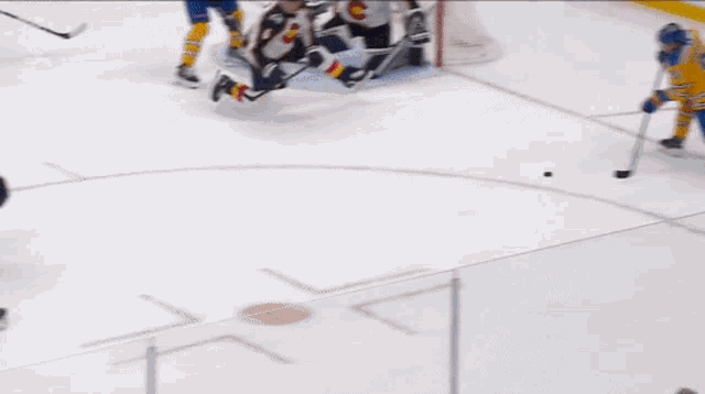 a hockey game is being played in front of a bjc health sign