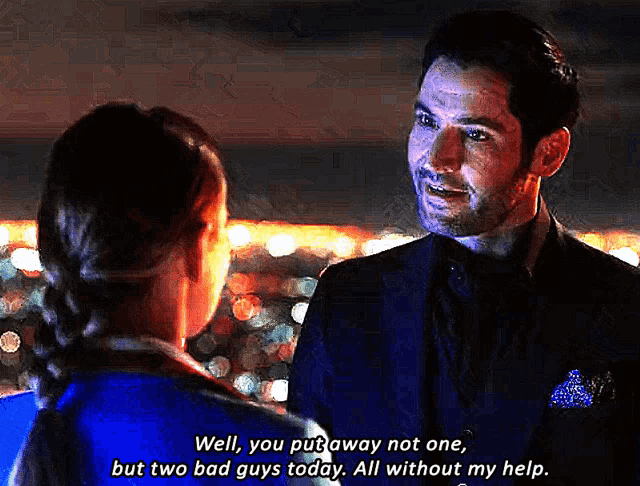 a man in a suit is talking to a woman in a blue shirt who is saying well you put away not one