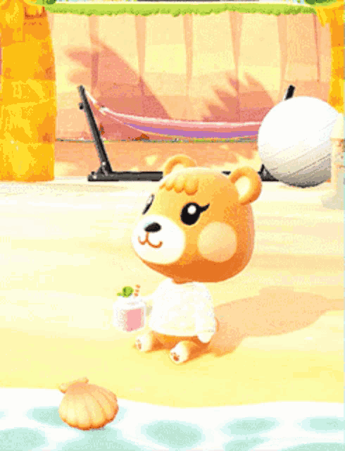 a teddy bear is holding a pink box on a beach