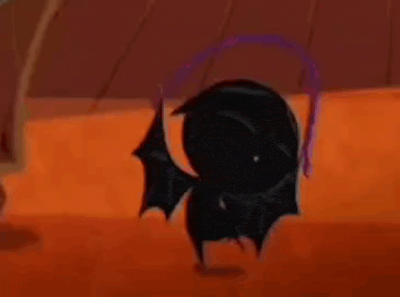 a cartoon bat with big eyes and wings is standing on an orange floor .